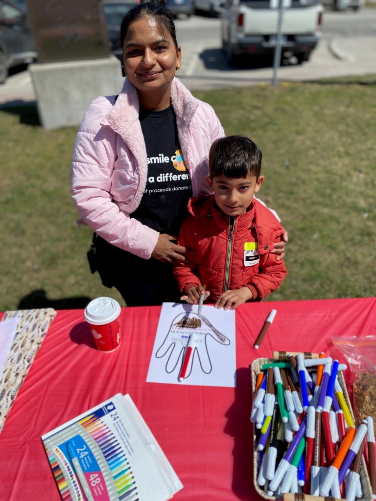 Amandeep Brar and her son, Jatinder (age 6) participated in poster and banner making. The creations were held by participants on the walk along West Street. 