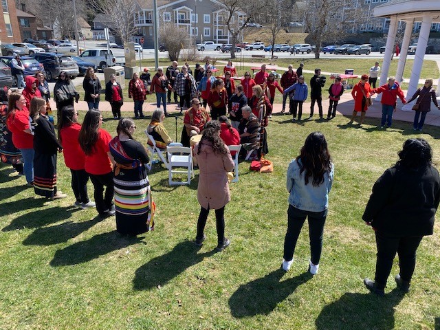 Women and girls formed a circle of unity around the Spirit Bay Drummers.