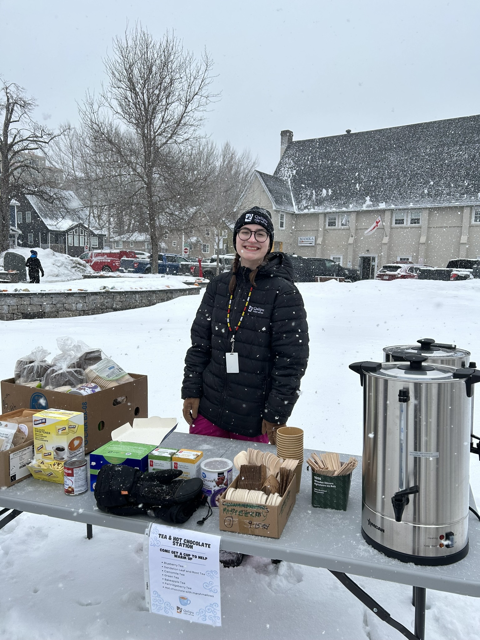 Marlie, Mental Wellness Outreach Officer serves tea and hot chocolate