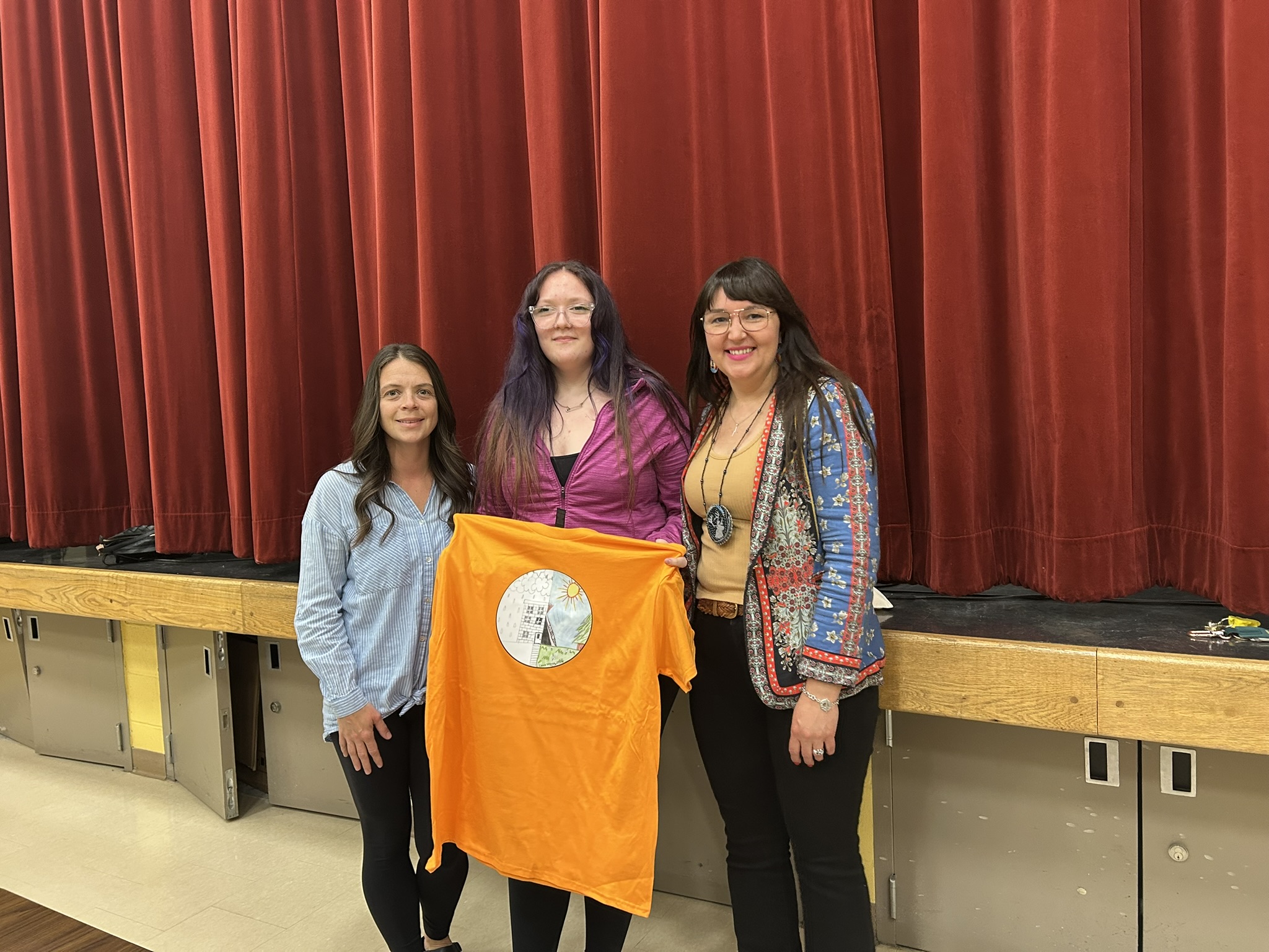 Presenting Lexis with her winning design on a t-shirt and a $250 cheque. L-R: Ms. Fennell, Lexis Wilcox, Chief Jenny Brake.