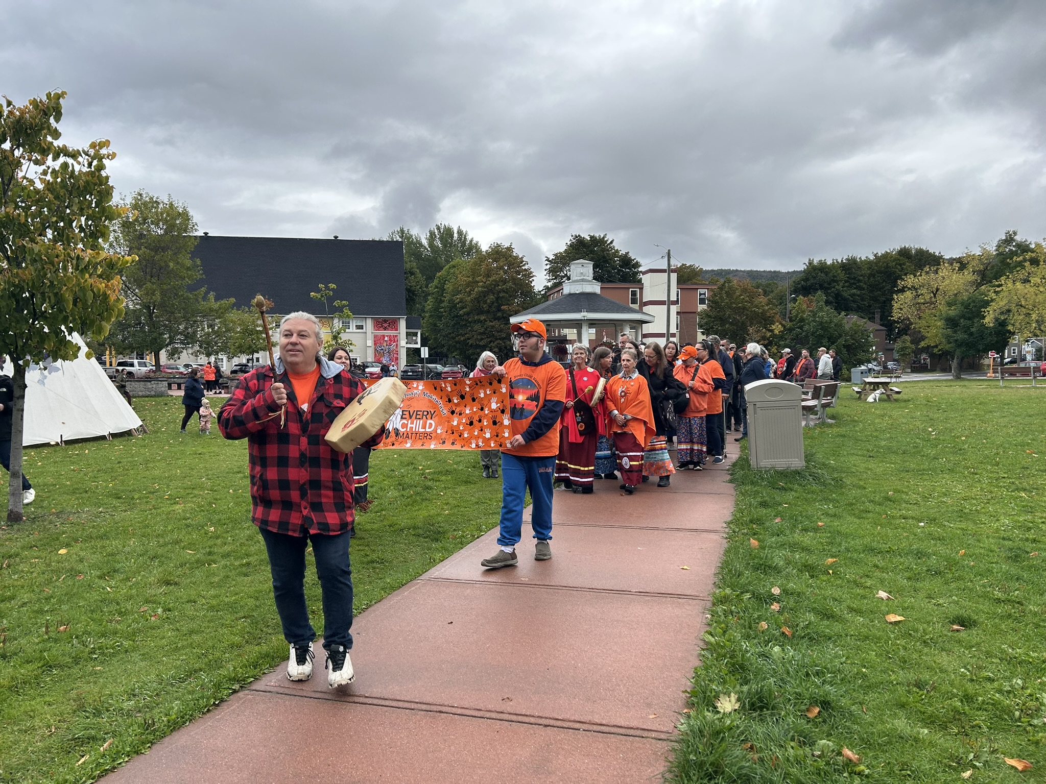 Paul Pike, Lead Cultural Outreach Officer leading the walk with singing and drumming 